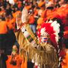 A student dressed as the Chief Illiniwek